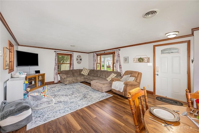107 S High St, Arcanum, OH 45304 - living room with wood finished floors, ornamental molding, and baseboards