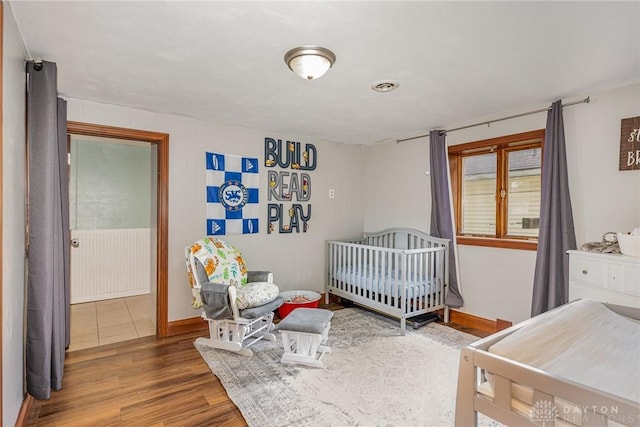 107 S High St, Arcanum, OH 45304 - bedroom with wood finished floors and baseboards