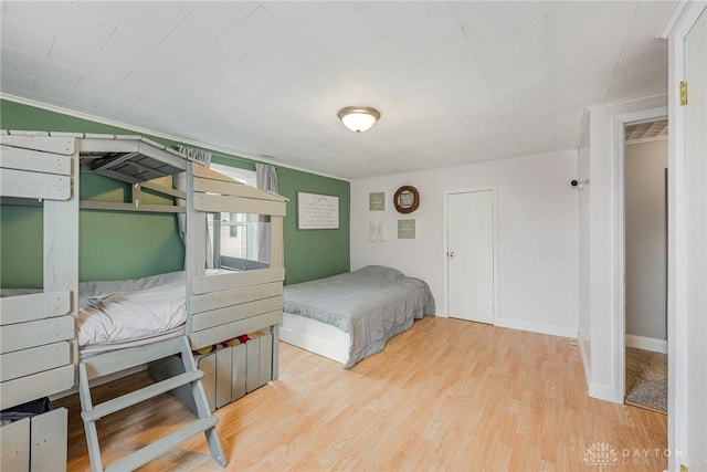 107 S High St, Arcanum, OH 45304 - bedroom featuring wood finished floors and ornamental molding