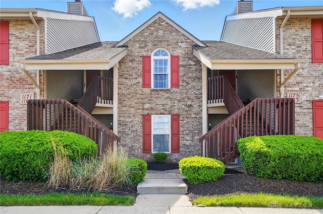 1175 Captains Brg, Dayton, OH 45458 - townhome / multi-family property with stairway, a chimney, and brick siding