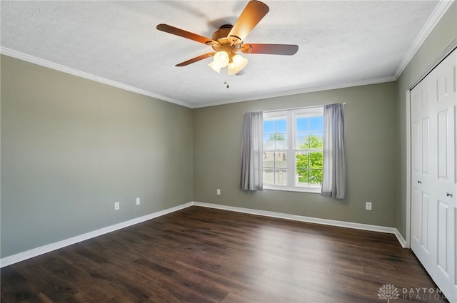 1175 Captains Brg, Dayton, OH 45458 - unfurnished bedroom with a textured ceiling, crown molding, baseboards, dark wood-type flooring, and a closet