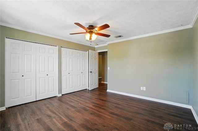 1175 Captains Brg, Dayton, OH 45458 - unfurnished bedroom featuring baseboards, dark wood finished floors, multiple closets, crown molding, and ceiling fan