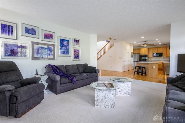 1233 Terrington Way, Miamisburg, OH 45342 - living area featuring light wood-style floors, recessed lighting, stairway, a ceiling fan, and a textured ceiling