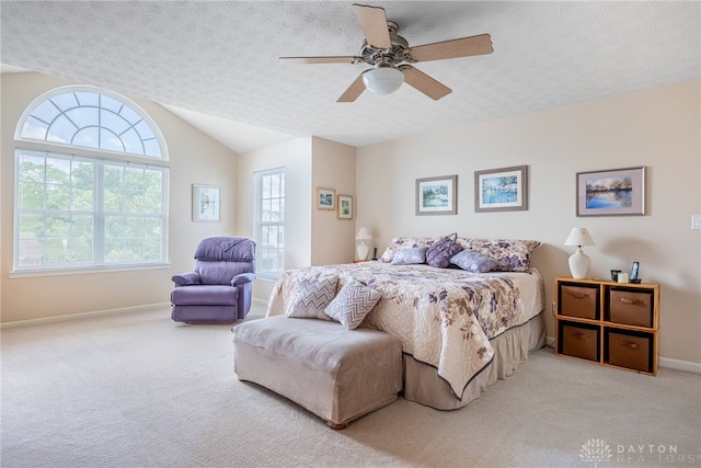 1233 Terrington Way, Miamisburg, OH 45342 - carpeted bedroom with baseboards, vaulted ceiling, a ceiling fan, and a textured ceiling