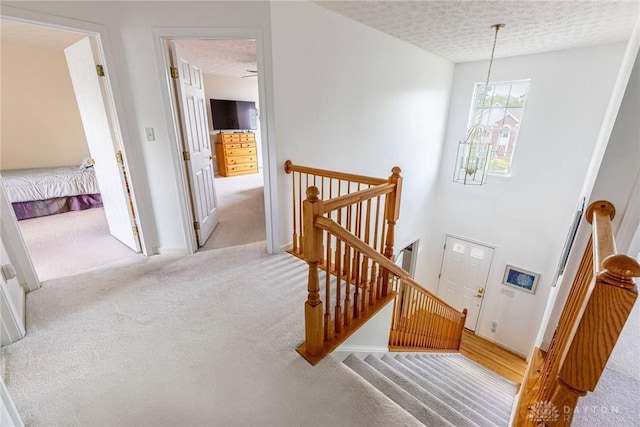 1233 Terrington Way, Miamisburg, OH 45342 - staircase featuring carpet, a textured ceiling, and baseboards