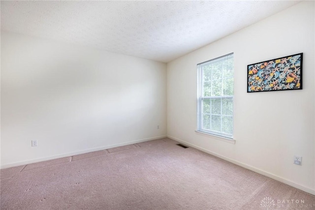 1233 Terrington Way, Miamisburg, OH 45342 - carpeted spare room with baseboards and a textured ceiling