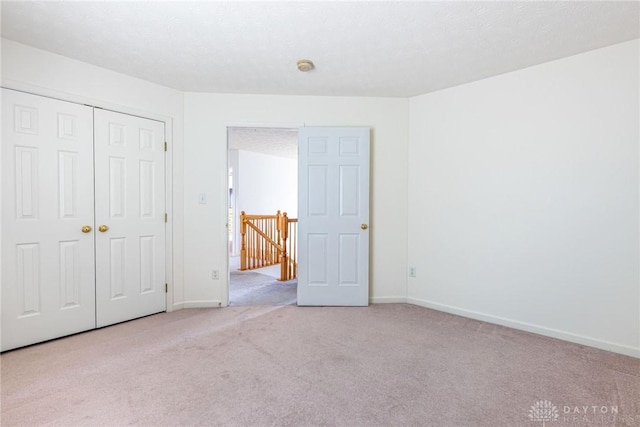 1233 Terrington Way, Miamisburg, OH 45342 - unfurnished bedroom with carpet floors, baseboards, and a closet