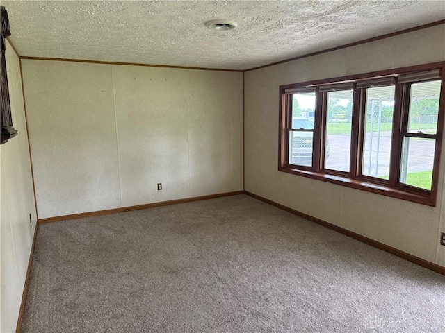 409 Skyview Dr, Vandalia, OH 45377 - unfurnished room featuring carpet flooring, ornamental molding, a textured ceiling, and baseboards