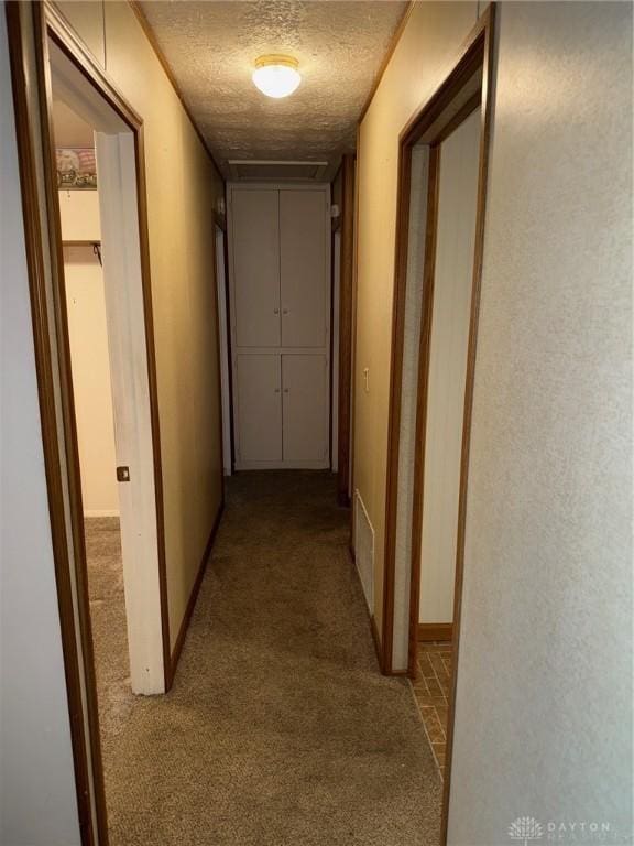 409 Skyview Dr, Vandalia, OH 45377 - corridor with carpet floors, a textured ceiling, and baseboards