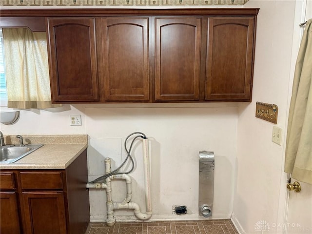 409 Skyview Dr, Vandalia, OH 45377 - laundry area featuring cabinet space and baseboards