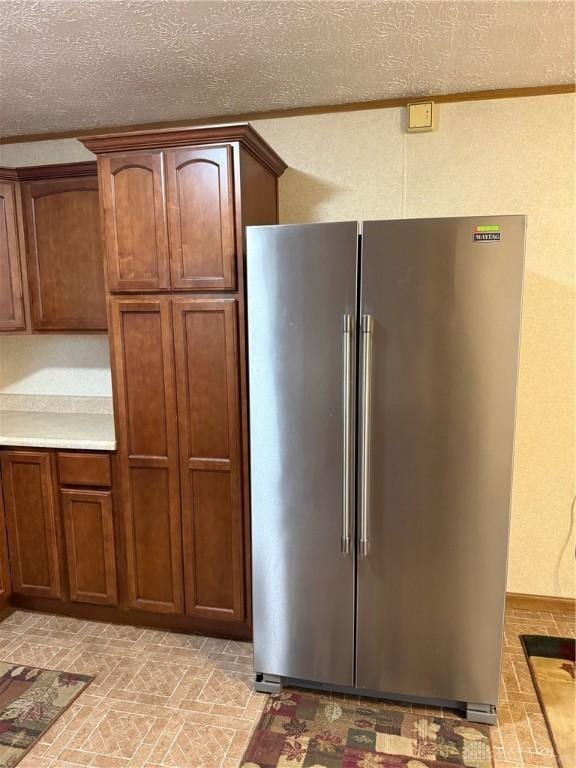 409 Skyview Dr, Vandalia, OH 45377 - kitchen with freestanding refrigerator, light countertops, and a textured ceiling