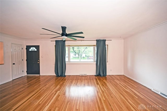 1525 Forrer Blvd, Kettering, OH 45420 - empty room featuring a ceiling fan, wood finished floors, ornamental molding, and baseboards