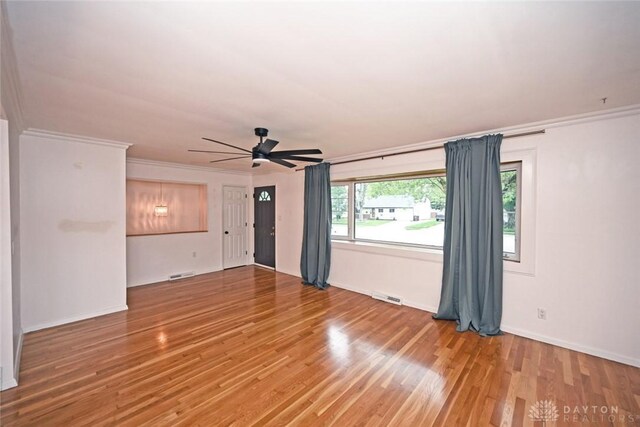 1525 Forrer Blvd, Kettering, OH 45420 - empty room with a ceiling fan, light wood-type flooring, baseboards, and crown molding