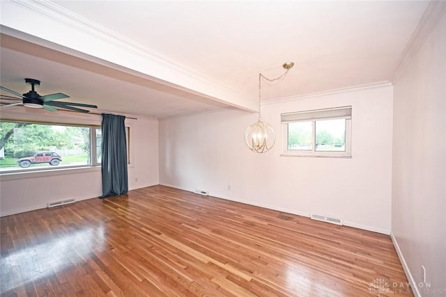 1525 Forrer Blvd, Kettering, OH 45420 - spare room featuring crown molding, plenty of natural light, light wood finished floors, a chandelier, and baseboards