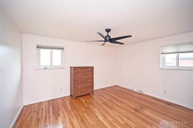 1525 Forrer Blvd, Kettering, OH 45420 - spare room with light wood-style flooring, ceiling fan, and baseboards