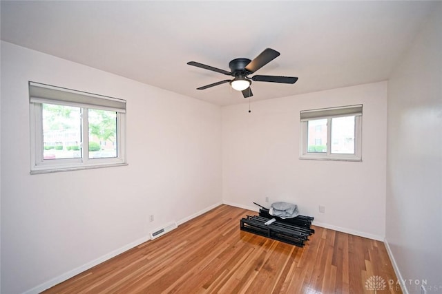 1525 Forrer Blvd, Kettering, OH 45420 - unfurnished room featuring wood finished floors, baseboards, and a ceiling fan
