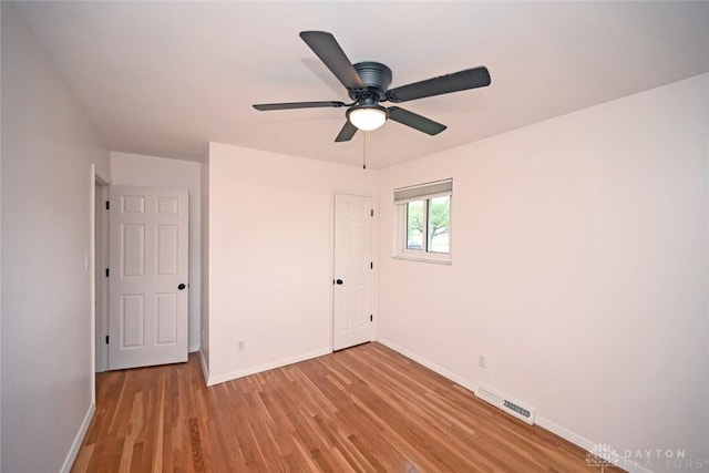 1525 Forrer Blvd, Kettering, OH 45420 - unfurnished bedroom with baseboards, light wood-type flooring, and ceiling fan