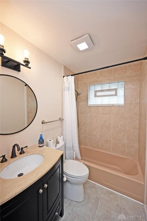 1525 Forrer Blvd, Kettering, OH 45420 - full bath featuring tile patterned floors, vanity, shower / tub combo, and toilet