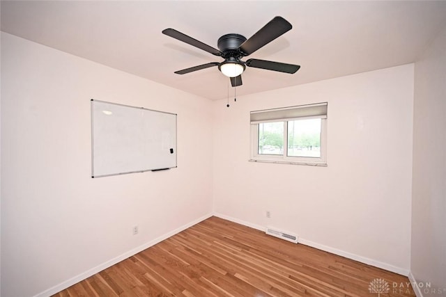 1525 Forrer Blvd, Kettering, OH 45420 - unfurnished room featuring baseboards, wood finished floors, and a ceiling fan