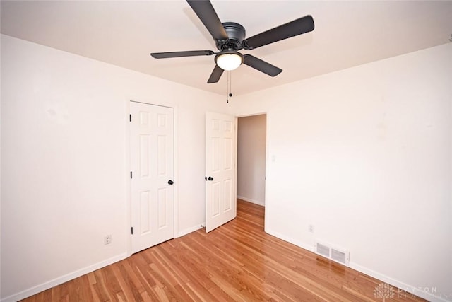 1525 Forrer Blvd, Kettering, OH 45420 - unfurnished bedroom featuring baseboards, light wood-style floors, and a ceiling fan