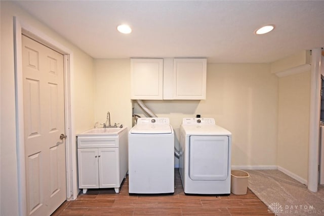 1525 Forrer Blvd, Kettering, OH 45420 - laundry room featuring washing machine and clothes dryer, cabinet space, wood finished floors, recessed lighting, and baseboards