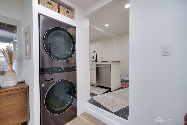 3227 Mirimar St, Dayton, OH 45409 - washroom featuring stacked washer / drying machine, recessed lighting, and wood finished floors