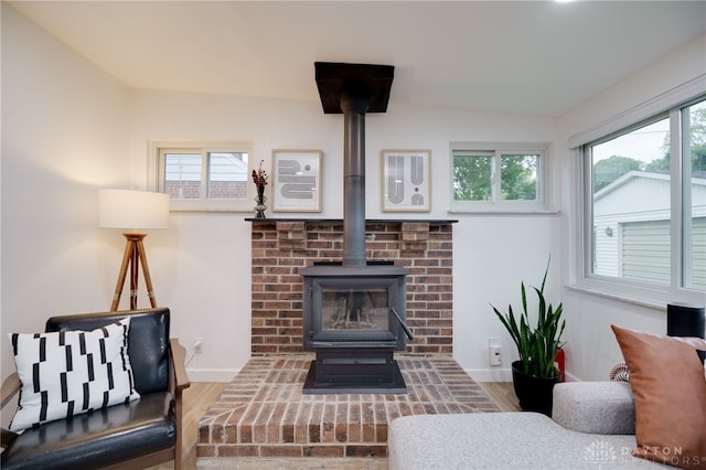 3227 Mirimar St, Dayton, OH 45409 - detailed view of a wood stove, wood finished floors, and baseboards