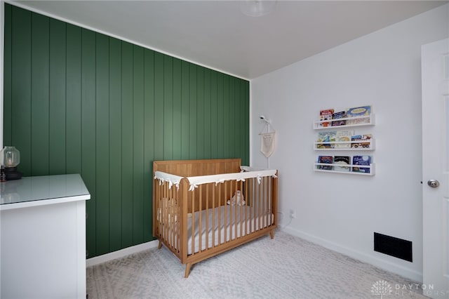 3227 Mirimar St, Dayton, OH 45409 - bedroom featuring carpet floors, baseboards, and a crib