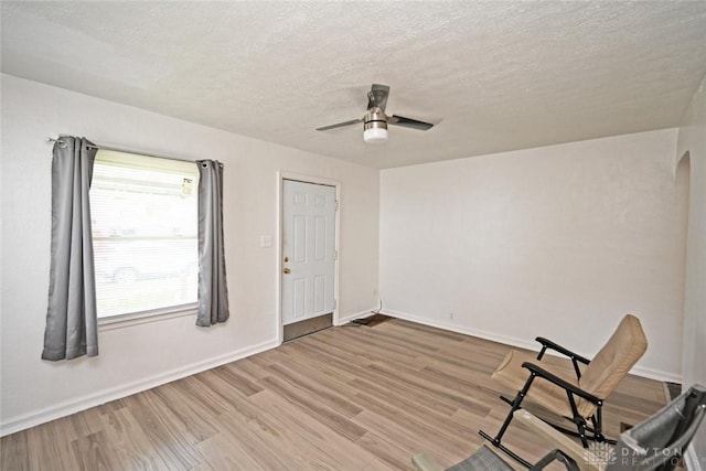 932 Crestmore Ave, Dayton, OH 45402 - unfurnished room featuring wood finished floors, ceiling fan, a textured ceiling, and baseboards