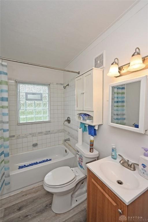 932 Crestmore Ave, Dayton, OH 45402 - full bath with vanity, shower / bath combo with shower curtain, toilet, wood finished floors, and crown molding