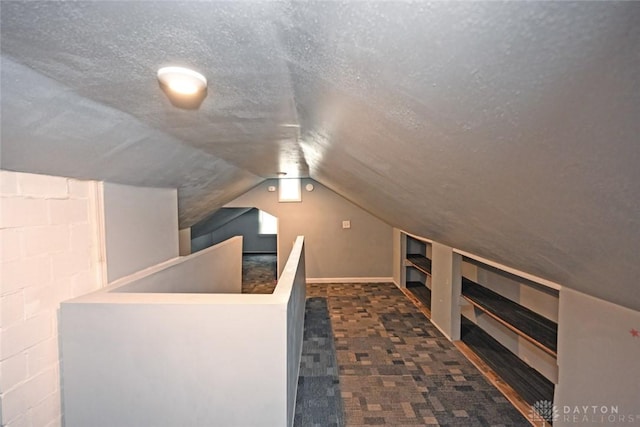 932 Crestmore Ave, Dayton, OH 45402 - additional living space with carpet floors, vaulted ceiling, and a textured ceiling