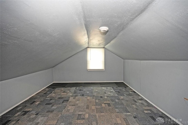 932 Crestmore Ave, Dayton, OH 45402 - additional living space with a textured ceiling, lofted ceiling, carpet floors, and baseboards