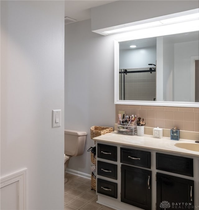 2155 Shenandoah Dr, Troy, OH 45373 - full bathroom with tasteful backsplash, toilet, vanity, a shower, and baseboards