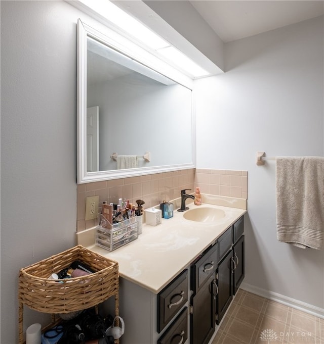 2155 Shenandoah Dr, Troy, OH 45373 - bathroom featuring vanity, tasteful backsplash, and baseboards
