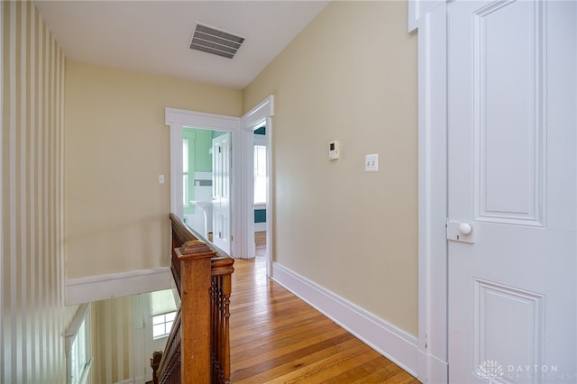 5894 Hamilton Lebanon Rd, Monroe, OH 45044 - hall featuring light wood-type flooring, an upstairs landing, and baseboards