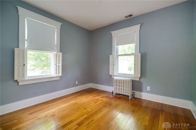 5894 Hamilton Lebanon Rd, Monroe, OH 45044 - spare room featuring radiator, baseboards, and light wood finished floors