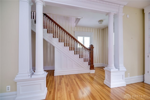 5894 Hamilton Lebanon Rd, Monroe, OH 45044 - stairs with wood finished floors, decorative columns, and baseboards
