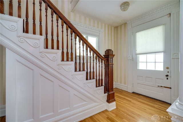 5894 Hamilton Lebanon Rd, Monroe, OH 45044 - entrance foyer with wallpapered walls, healthy amount of natural light, stairs, and light wood-type flooring