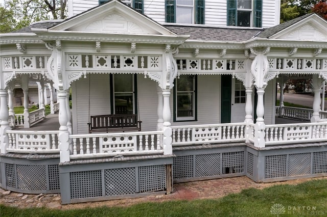 5894 Hamilton Lebanon Rd, Monroe, OH 45044 - back of house featuring covered porch and a chimney