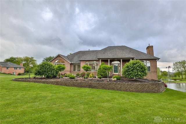 3085 State Route 122, Springboro, OH 45005 - view of front of home with a front lawn, a chimney, brick siding, and roof with shingles