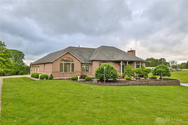3085 State Route 122, Springboro, OH 45005 - view of front of property featuring a chimney, a front lawn, brick siding, and a shingled roof