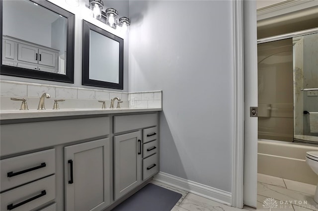 3085 State Route 122, Springboro, OH 45005 - bathroom with marble look tiles, double vanity, toilet, washtub / shower combination, and baseboards