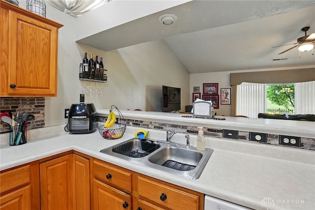 1248 Kern Dr, Germantown, OH 45327 - kitchen featuring a sink, open floor plan, light countertops, brown cabinetry, and lofted ceiling