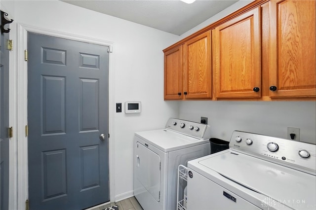 1248 Kern Dr, Germantown, OH 45327 - laundry area with cabinet space, separate washer and dryer, and baseboards