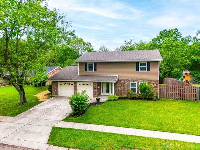 4513 Silver Oak St, Dayton, OH 45424 - traditional-style house featuring a garage, brick siding, a playground, and concrete driveway