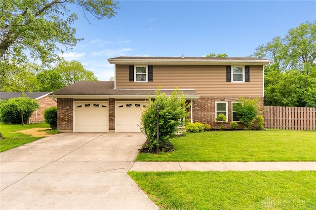 4513 Silver Oak St, Dayton, OH 45424 - traditional-style home with concrete driveway, brick siding, and a garage