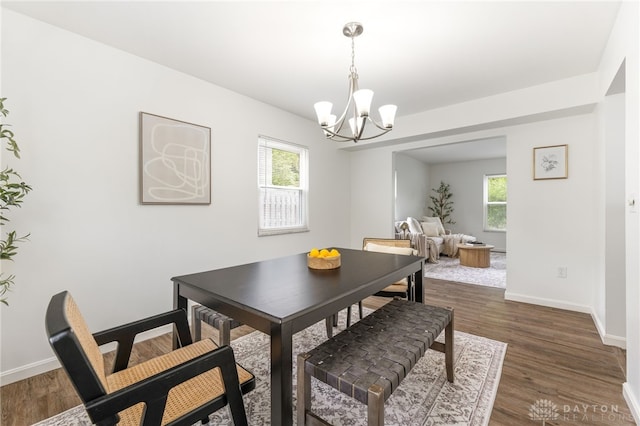 4513 Silver Oak St, Dayton, OH 45424 - dining space with a chandelier, plenty of natural light, dark wood-style floors, and baseboards