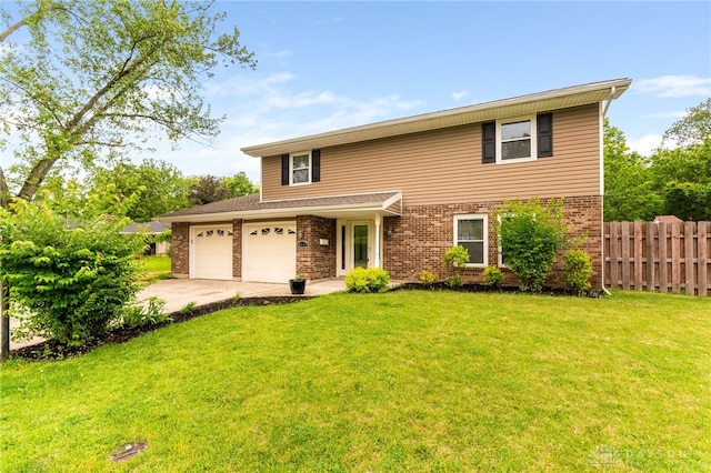 4513 Silver Oak St, Dayton, OH 45424 - traditional home with brick siding, driveway, and a garage