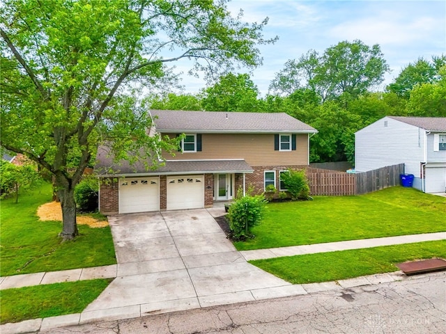 4513 Silver Oak St, Dayton, OH 45424 - traditional-style home with concrete driveway, brick siding, an attached garage, and roof with shingles