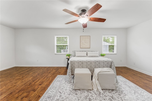 4513 Silver Oak St, Dayton, OH 45424 - bedroom featuring multiple windows, wood finished floors, baseboards, and ceiling fan